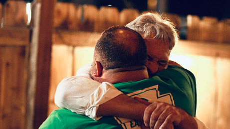 Two men embracing